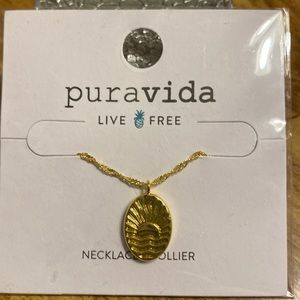 PuraVida Necklace•Collier, Gold in color with a sun looking design